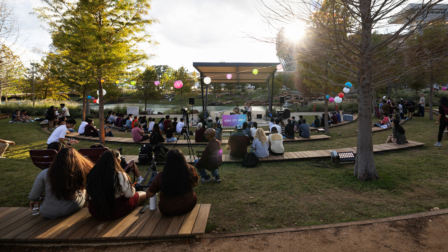 Students listen to a band in Aggie Park