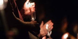 lighting candles at Muster ceremony
